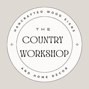 May include: Black and white logo with the text "The Country Workshop" and "Handcrafted Wood Signs and Home Decor" in a circle.