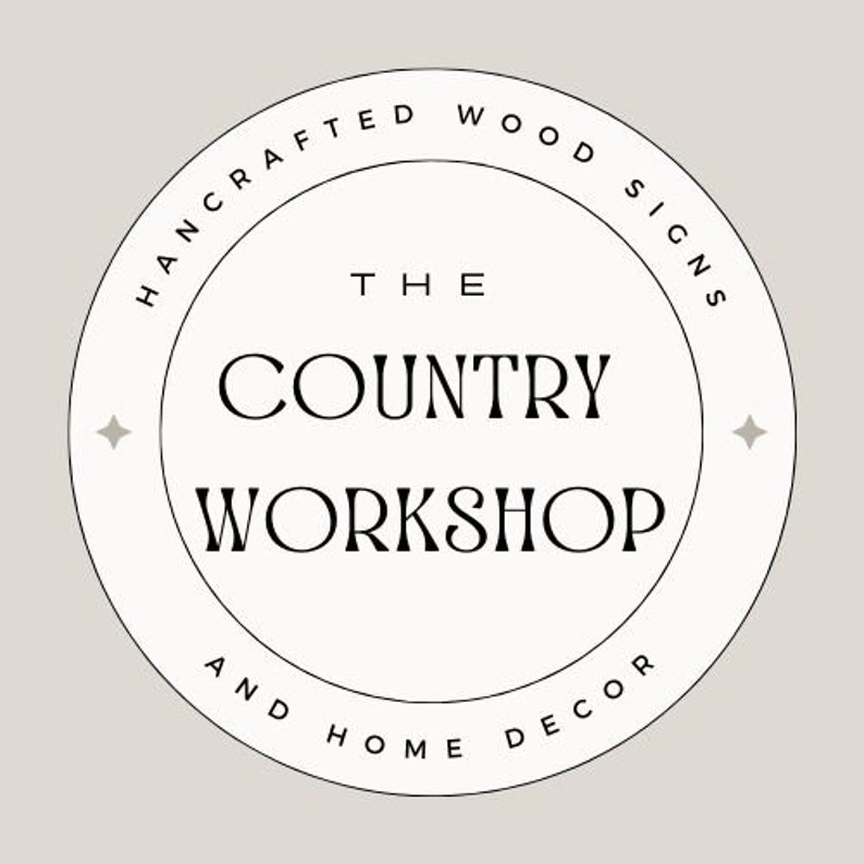 May include: Black and white logo with the text "The Country Workshop" and "Handcrafted Wood Signs and Home Decor" in a circle.