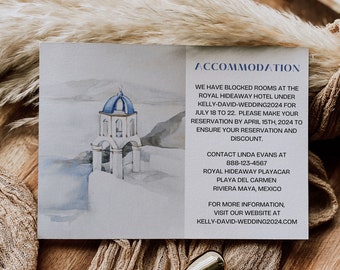 May include: A white card with blue and gray watercolor artwork of a white building with a blue dome. The text on the card reads "Accommodation" and provides information about a hotel, contact information, and a website address. "Kelly-David-Wedding2024.com"