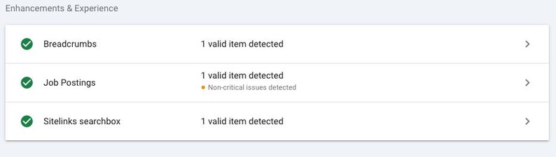 May include: Screenshot of a website displaying a list of website enhancements and their status. The list includes Breadcrumbs, Job Postings, and Sitelinks searchbox. Each item has a green tick indicating that it is valid and a number indicating the number of valid items detected. The Job Postings item also has a yellow warning icon indicating that there are non-critical issues detected.