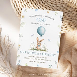 May include: A blue and white first birthday invitation with a cute bunny holding a blue balloon. The invitation says "Some bunny is turning one" and includes the text "Matthew's 1st Birthday".