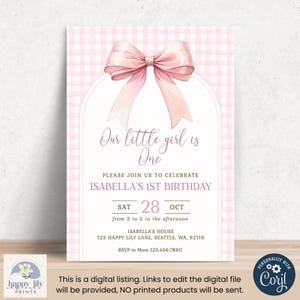 May include: Pink and white gingham patterned printable invitation with a large pink bow at the top. The text reads "Our little girl is One. Please join us to celebrate Isabella's 1st Birthday. Sat 28 Oct from 3 to 5 in the afternoon. Isabella's House 123 Happy Lily Lane, Seattle, WA, 92119. RSVP to Mom 123.456.7890"
