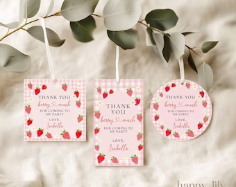 May include: Pink strawberry-themed gift tags with the text "Thank You berry much for coming to my party, Love, Isabella." The tags are in square, rectangular, and circular shapes, with a gingham pattern and strawberry illustrations.