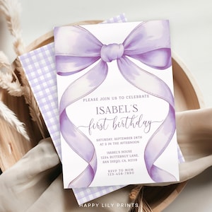 May include: A lilac-colored invitation for Isabel's first birthday, featuring a large bow design. The invitation includes the text "PLEASE JOIN US TO CELEBRATE ISABEL'S first birthday" and event details. The design is on a white background with a gingham pattern.