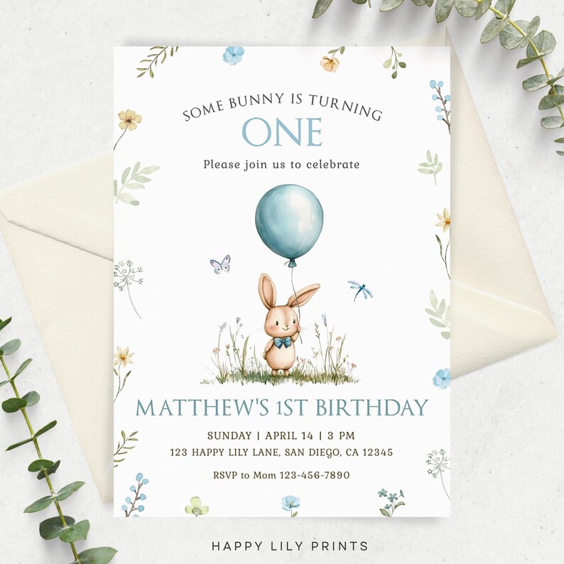 May include: A blue and white birthday invitation with a cute bunny rabbit holding a blue balloon. The invitation says "Some bunny is turning one" and "Matthew's 1st Birthday".
