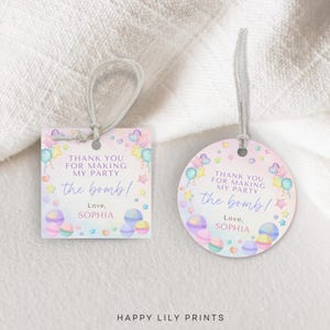 May include: Two pastel pink and purple thank you tags with a rainbow background and colorful balloons, stars, and hearts. The text on the tags reads "Thank you for making my party the bomb! Love, Sophia".