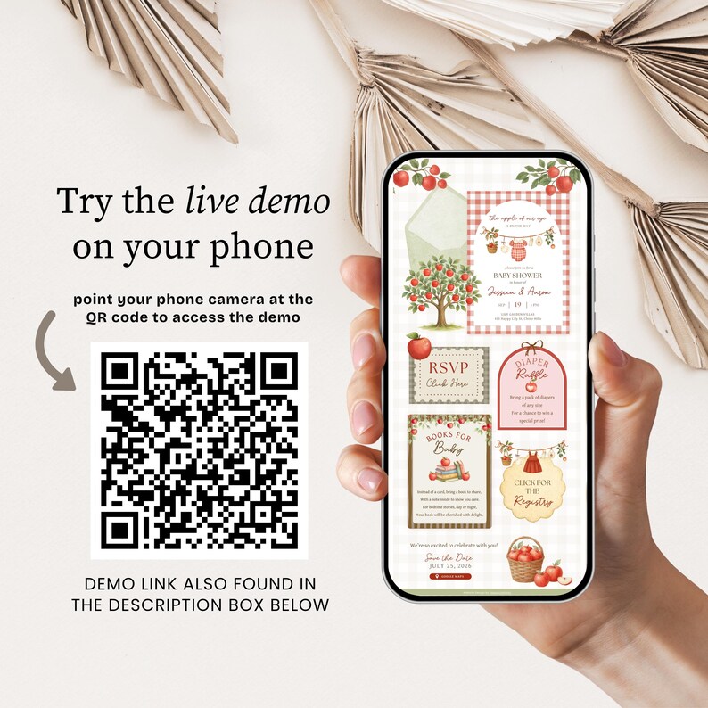 May include: A smartphone displaying a digital baby shower invitation suite with an apple theme, featuring a QR code to the left with text reading Try the live demo on your phone, point your phone camera at the QR code to access the demo.