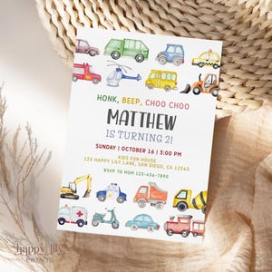 May include: A white invitation card with watercolor illustrations of various vehicles, including cars, trucks, and a helicopter. The text reads "HONK, BEEP, CHOO CHOO" and "MATTHEW IS TURNING 2!" with event details.