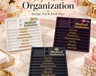 May include: Three rectangular medical esthetics organizer trays in white, dark purple, and black. Each tray features a square compartment, two circular slots, and six horizontal rows labeled with treatment areas like Frontalis and Glabella.