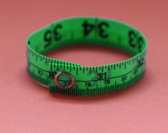 Tape Measure Bracelet in Green - Statement Jewelry created with Upcycled Measuring Tape - Vinyl Snap Bracelet - Crafty Repurposed Trashion