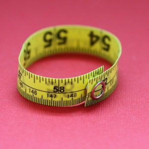 Tape Measure Bracelet in Yellow - Statement Jewelry created with Upcycled Measuring Tape - Vinyl Snap Bracelet - Crafty Repurposed Trashion