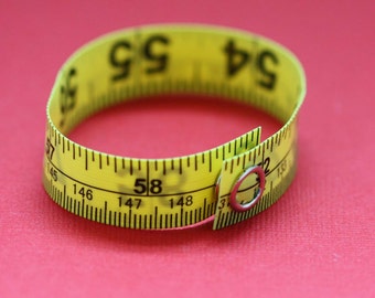 Tape Measure Bracelet in Yellow - Statement Jewelry created with Upcycled Measuring Tape - Vinyl Snap Bracelet - Crafty Repurposed Trashion