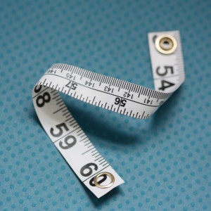 Tape Measure Bracelet in White - Statement Jewelry created with Upcycled Measuring Tape - Vinyl Snap Bracelet - Crafty Repurposed Trashion