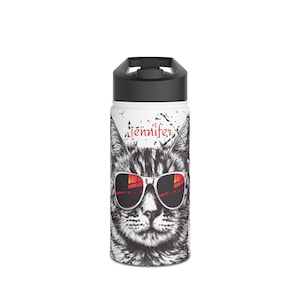 May include: White insulated water bottle featuring a black and white illustration of a cat wearing sunglasses. The sunglasses reflect a red and orange sunset. The name "Jennifer" is printed in red above the cat's head. The bottle has a black lid.