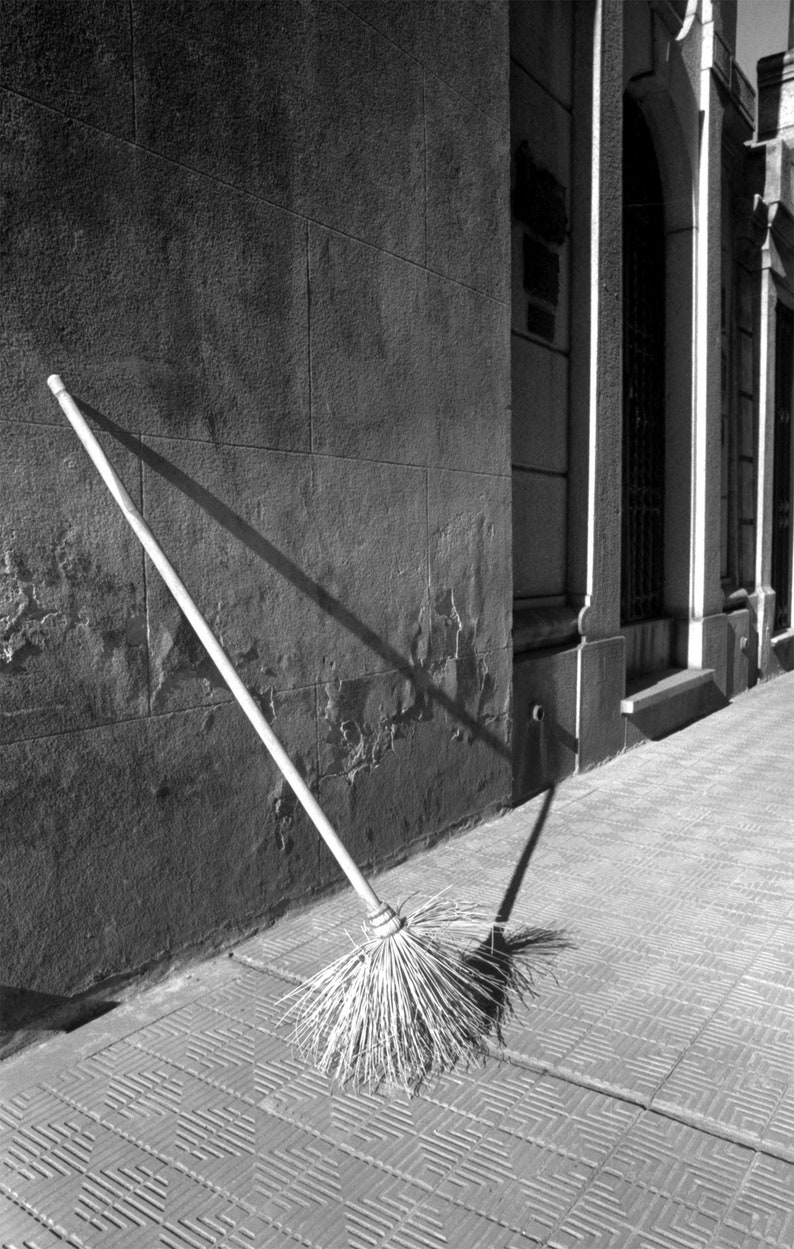 Black and White Photo of a Broom in a Cemetery in Argentina