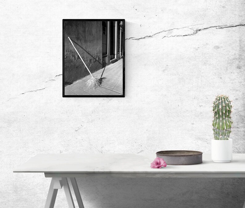 Black and White Photo of a Broom in a Cemetery in Argentina