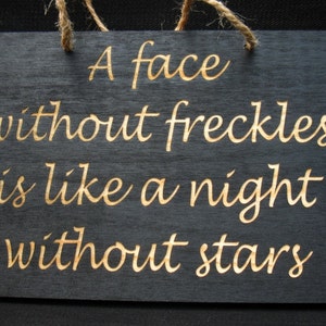 A face without freckles is like a night without stars wooden sign