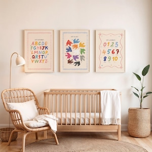 May include: Three framed educational prints for a nursery. The prints display the alphabet, colors, and numbers. The alphabet print has a colorful border and letters. The color print shows colorful bird shapes. The number print has numbers 0-10.