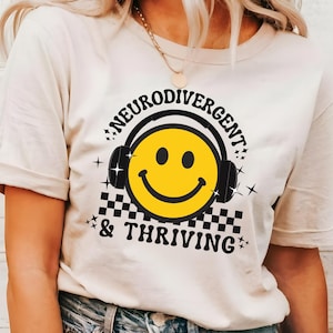 May include: A set of three ceramic mugs with a speckled, matte finish. The mugs are in shades of cream, light gray, and dark gray. Each mug has a simple, minimalist design, perfect for coffee or tea.