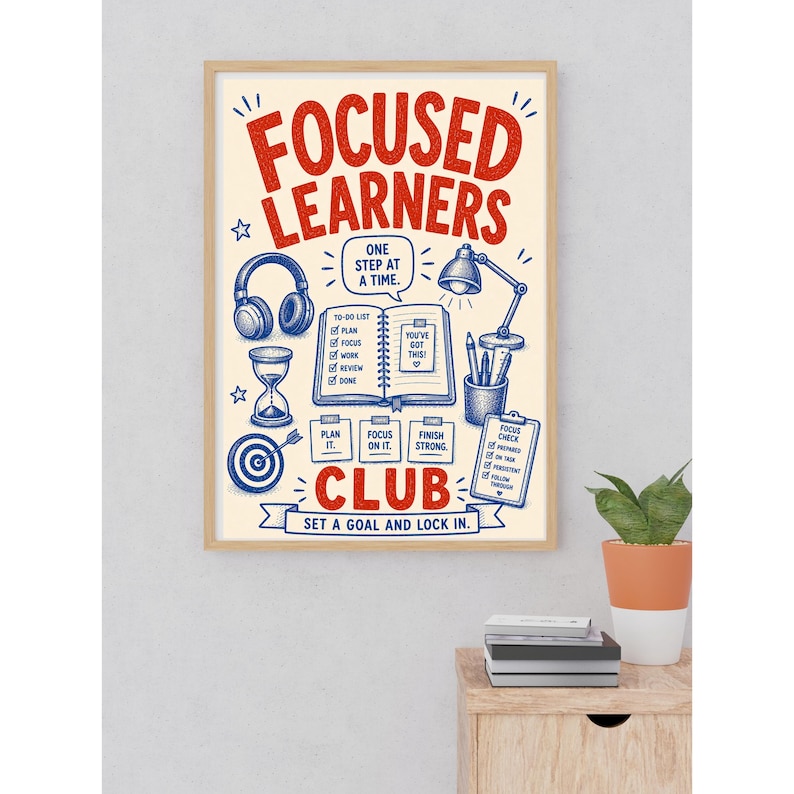 May include: A rectangular wall poster in a light wood frame featuring the red text FOCUSED LEARNERS CLUB and blue illustrations of headphones, an hourglass, a target, a desk lamp, a pencil holder, and an open notebook with a to-do list.