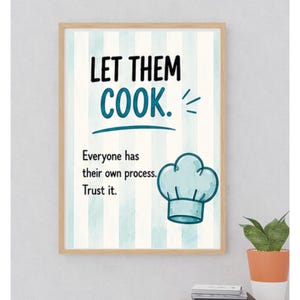 May include: A framed wall art print featuring vertical light blue and white stripes. The text reads "LET THEM COOK." followed by "Everyone has their own process. Trust it." A light blue chef hat illustration is positioned on the lower right side.