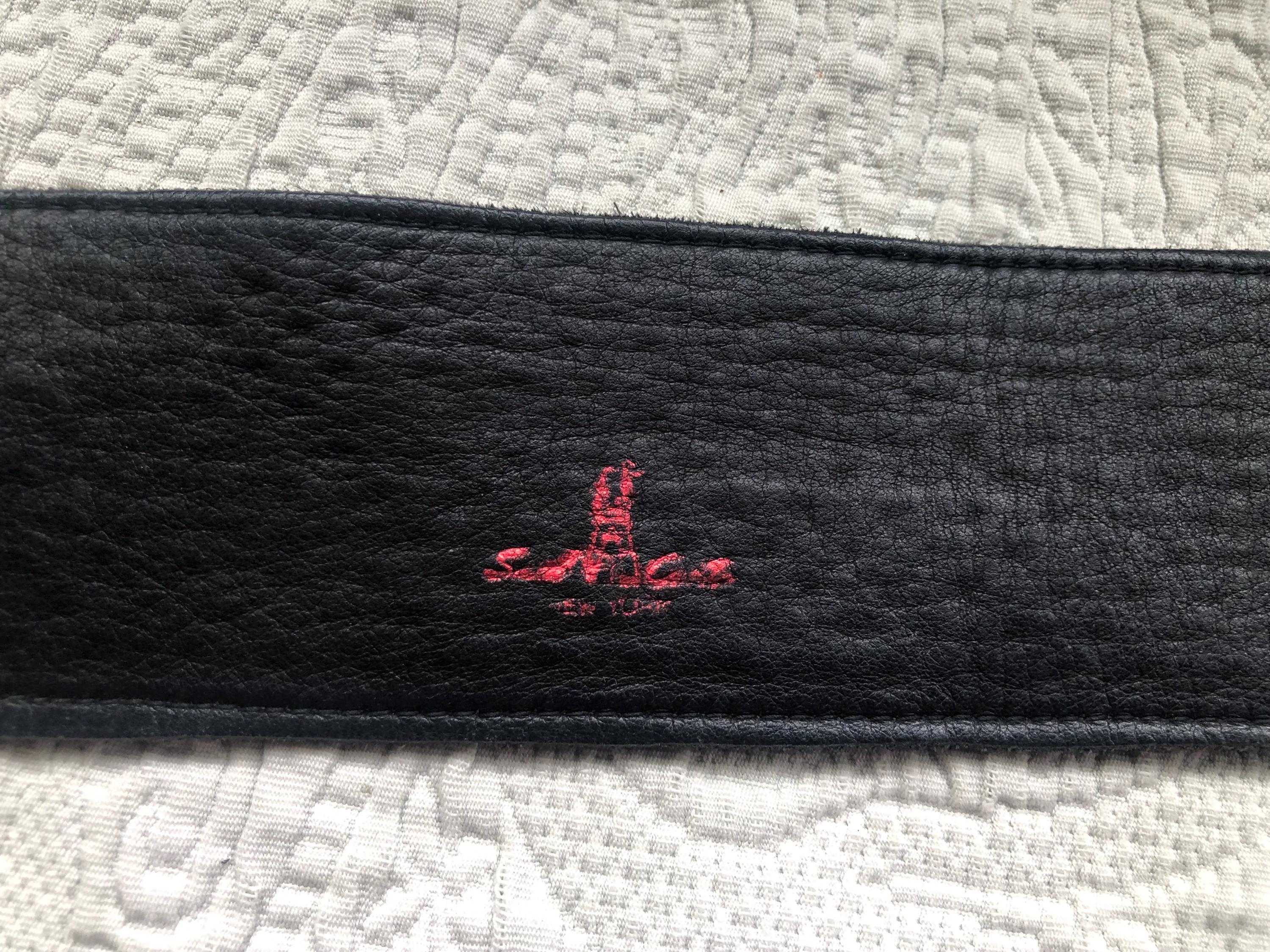 Gently Used Sand Castle New York Black Leather and Brass 