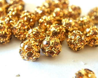 6 stuks vintage Swarovski-kralen: lichtbruine kristallen bol, verguld (10 mm)