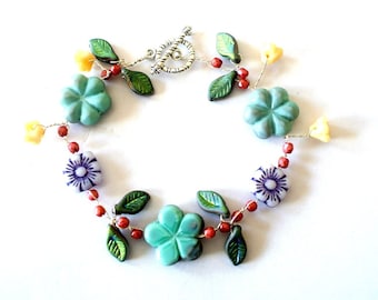 Bracelet twised wire with beaded Czech flower and leaves glass beads earth colors, artisian 7.5inches