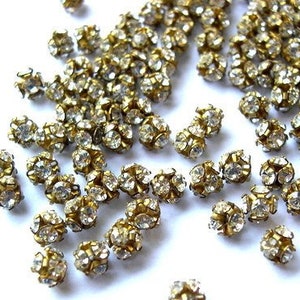 10 Vintage Swarovski crystal ball beads, 4mm, clear rhinestones in brass setting RARE image 1