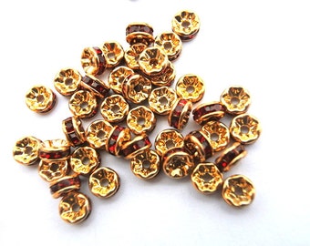 10 Vintage Swarovski rondelle beads red crystal rhinestone on gold color base 7mm spacer beads