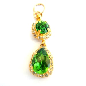 Pendant, handmade of Swarovski crystals embeded in gold plated metal