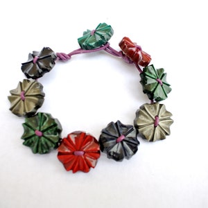 Button bracelet made of antique vintage flower plastic buttons in rare color and design