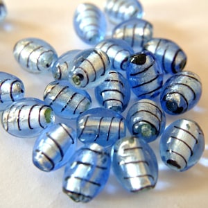 Beads, 6 glass blue with black, handmade, 14mmx11mm, glass foiled beads