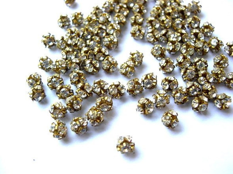 10 Vintage Swarovski crystal ball beads, 4mm, clear rhinestones in brass setting RARE image 1