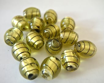 Beads, 6 glass green with black, handmade, 14mmx11mm, glass foiled beads