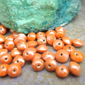 25 Vintage glass beads beautiful orange 7mmx4.5mm