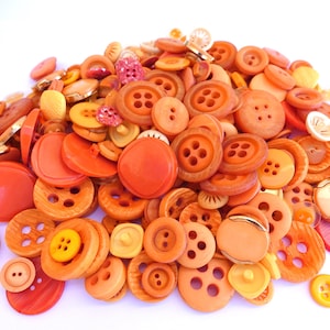 220 Buttons, antique and vintage plastic deep yellow to orange shades buttons, 22 designs, assorted shapes and shades