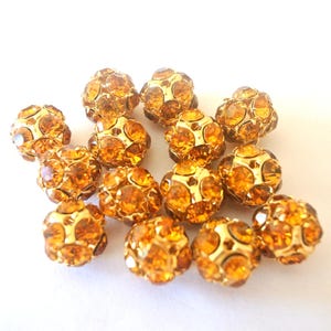 Vintage Swarovski crystal ball bead 13mm, warm yellow rhinestones in brass setting- RARE