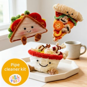 May include: A whimsical pipe cleaner kit featuring a sandwich, pizza slice, and a bowl of food, all with smiling faces. The kit includes a white mug and a white tray. The image has the text "Pipe cleaner kit" and "CHILL FUZZ" on a yellow circle.