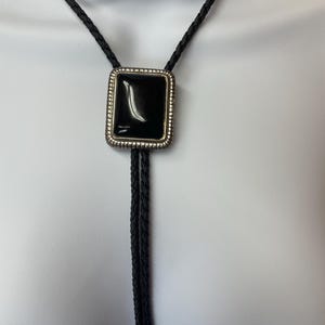 Black and Silver Bolo Tie on Black Leather Cord