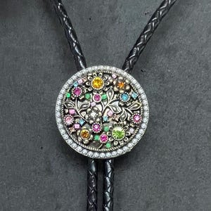 Round Metal Bolo with Colored Rhinestones on Black Leather Cord