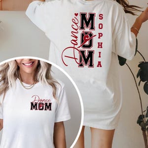 May include: White t-shirt with a red and black "Dance Mom" graphic on the front and back. The back of the shirt features the name "Sophia" in red letters. The design includes a dancer silhouette.