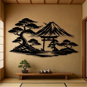 May include: Black metal wall art depicting a Japanese landscape with a mountain, trees, and a traditional gate. The artwork is mounted on a beige wall, with a wooden bench and bonsai tree in the foreground. The scene evokes a sense of tranquility.