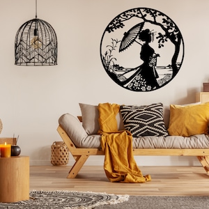 May include: Black metal wall art featuring a silhouette of a woman holding an umbrella under a tree. The art is circular and has a detailed design with floral elements.