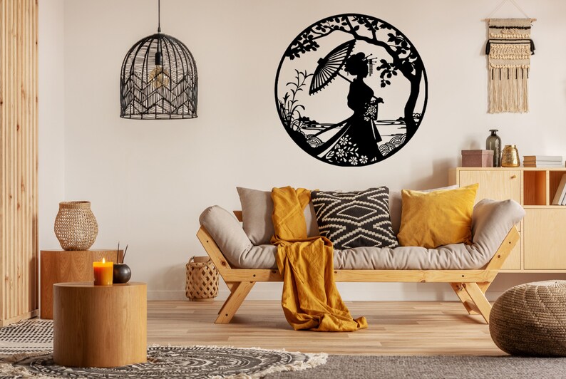 May include: Black metal wall art featuring a silhouette of a woman holding an umbrella under a tree. The art is circular and has a detailed design with floral elements.