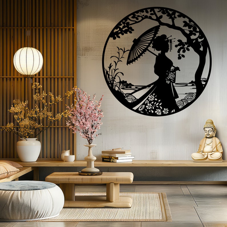 May include: Black metal wall art featuring a woman with an umbrella standing under a tree in a circle. The art is displayed on a wall in a room with a wooden floor, a wooden table, and a vase of flowers.