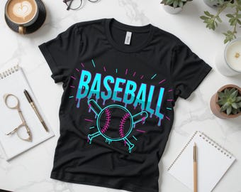 May include: Black t-shirt with a baseball graphic. The word "BASEBALL" is in large, dripping, blue and teal letters. A baseball and crossed bats are below the word, outlined in teal and pink.