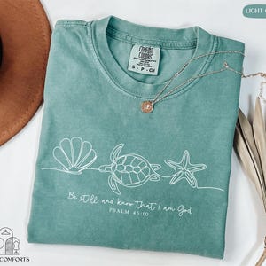 a t - shirt with a picture of a turtle on it