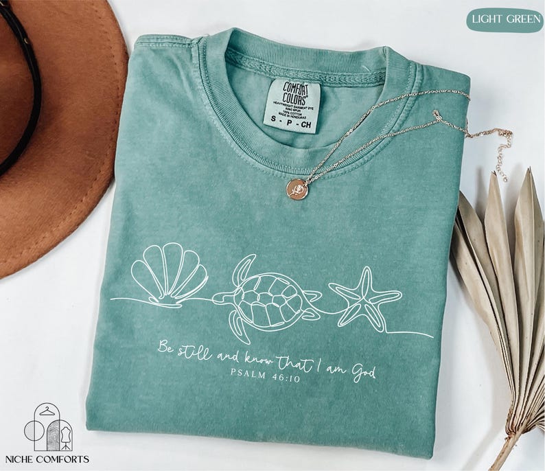 a t - shirt with a picture of a turtle on it