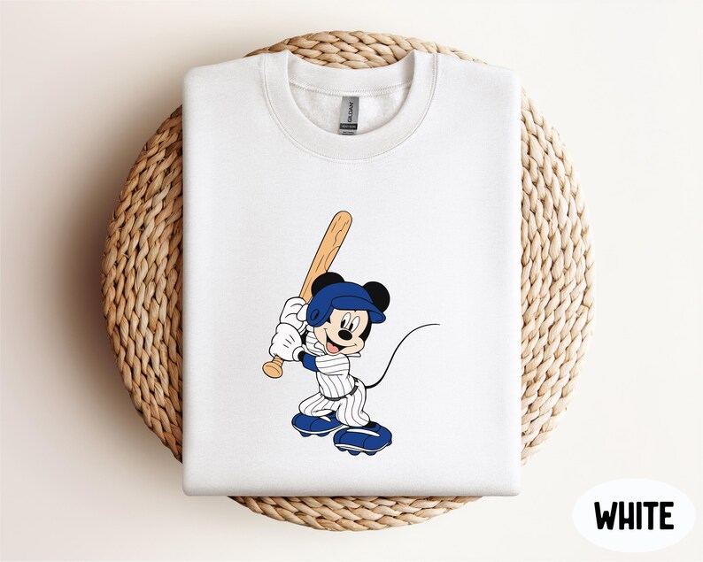a mickey mouse t - shirt with a baseball bat on it